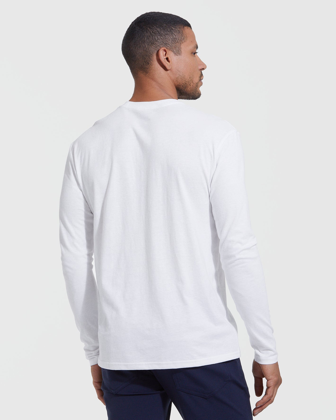 Man wearing All White Long Sleeve Crew Neck T-shirt from 3-Pack.
