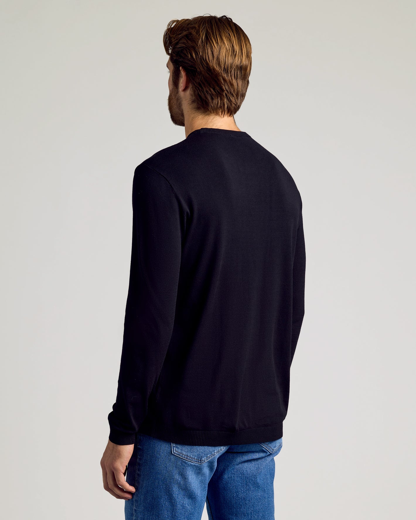 Black Crew Neck Sweater 2-Pack on man, showing slim fit from back.