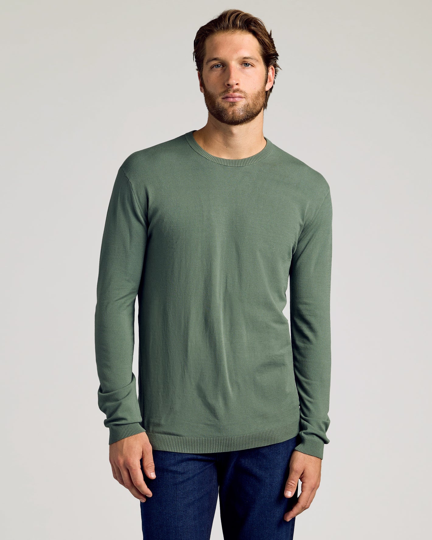Man wearing Black & Moss Crew Neck Sweater 2-Pack, slim fit.