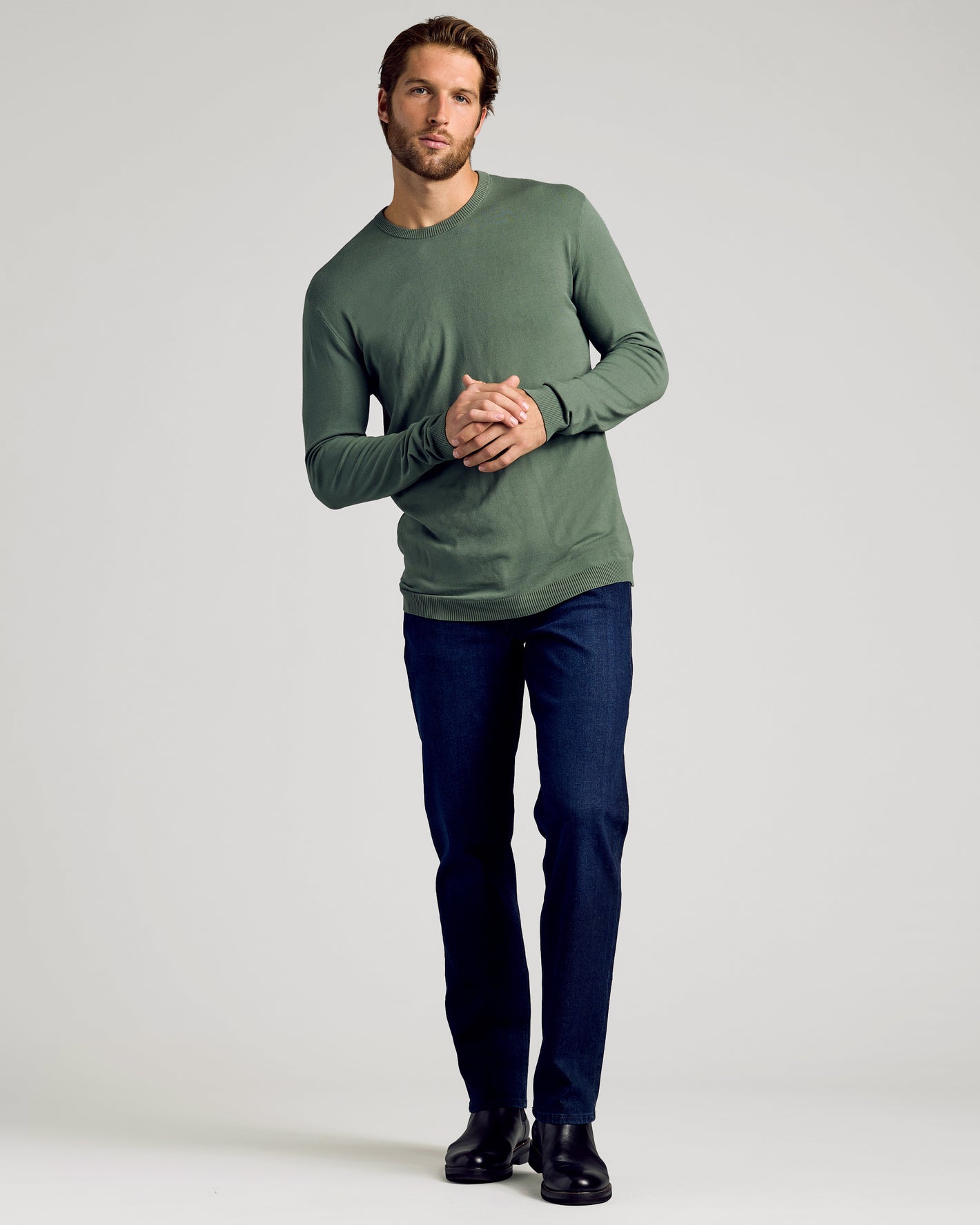 Man wearing Black & Moss Crew Neck Sweater 2-Pack with jeans and boots.