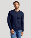 Man wearing Black & Navy Crew Neck Sweater 2-Pack with light-wash jeans.
