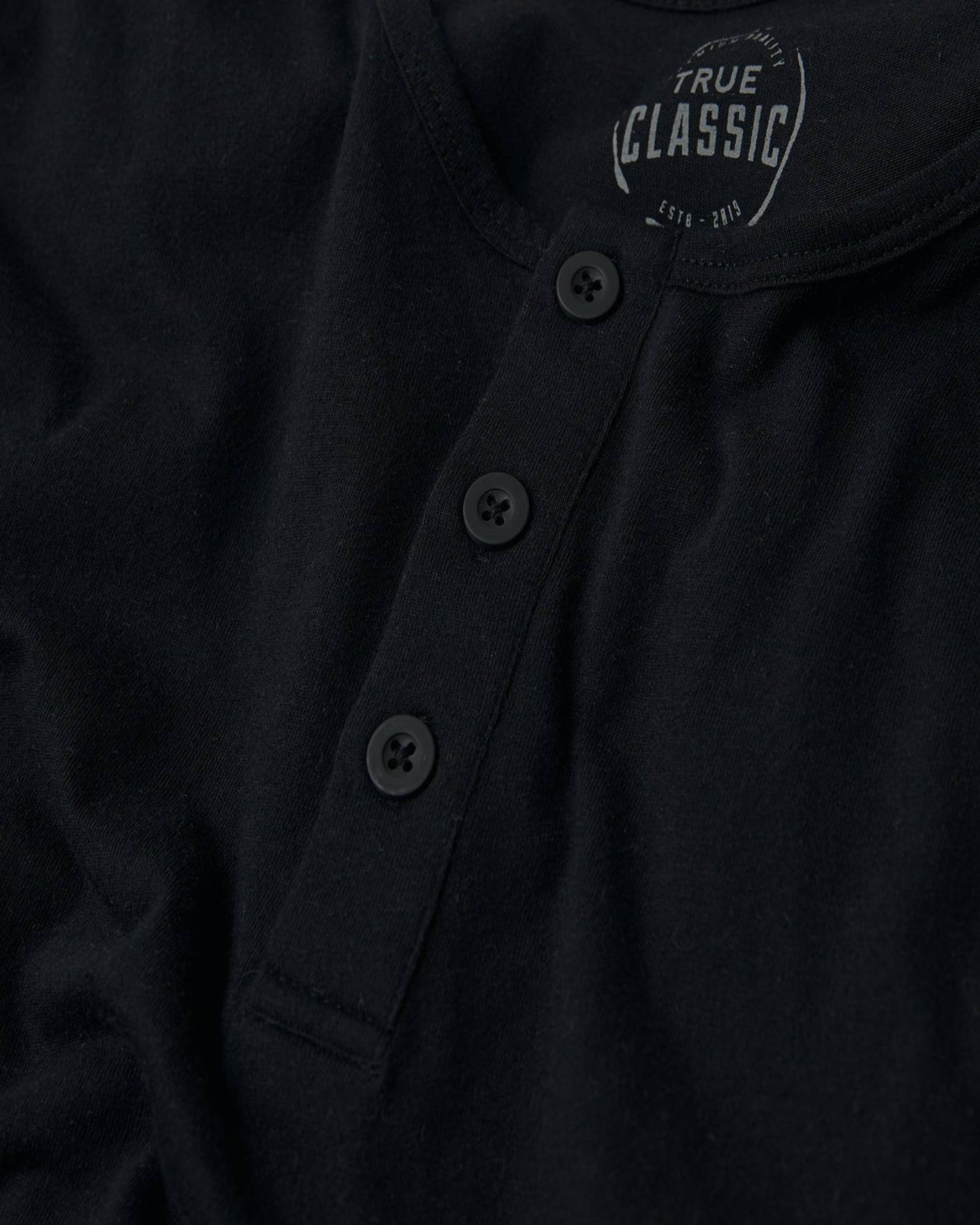 All Black Classic Henley 3-Pack showing button placket and TRUE CLASSIC label.