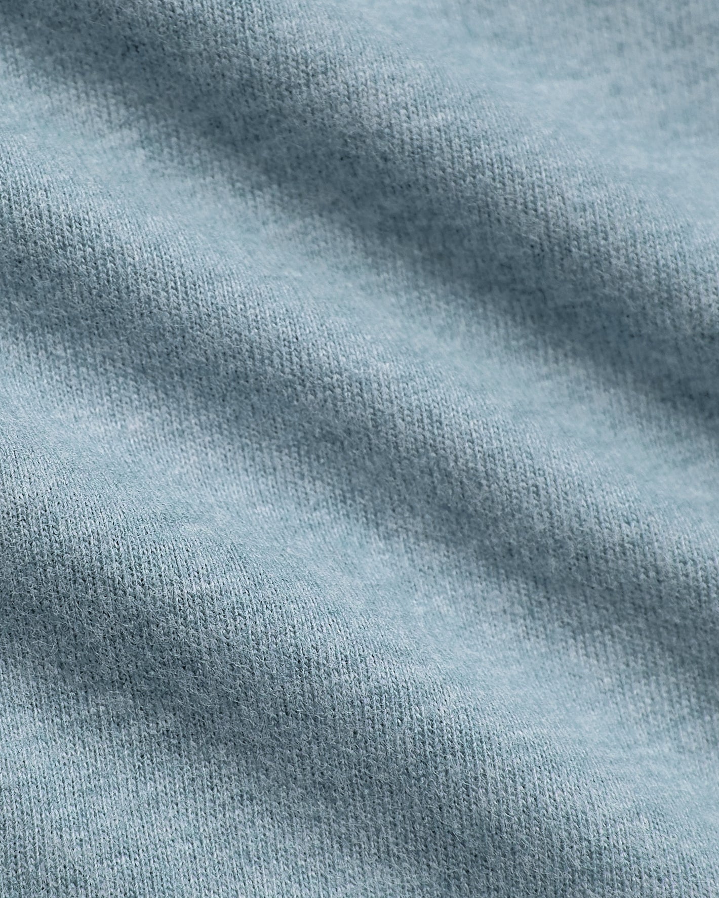 Heather Sapphire Classic Long Sleeve Henley, showcasing textured light-blue knit fabric.