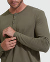Man adjusting sleeve of olive Classic Henley 6-Pack shirt.