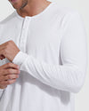 Man wearing All White Classic Henley, adjusting sleeve cuff.