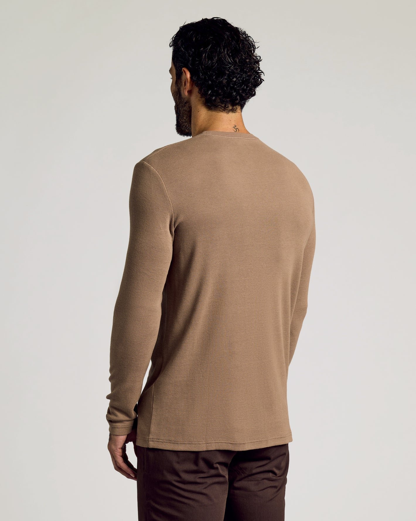 Back view of man in Alpaca Waffle Long Sleeve Crew Neck.