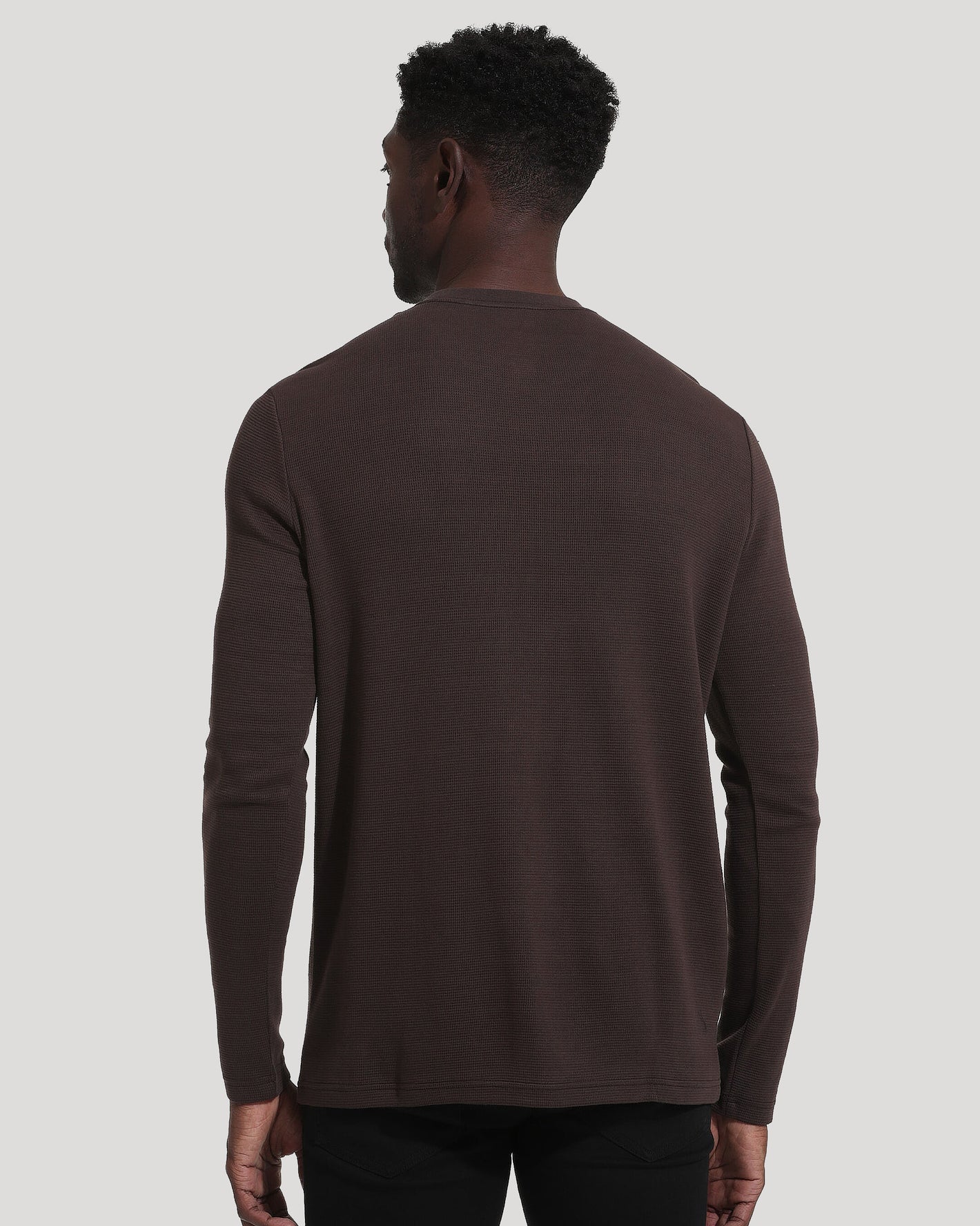 Dark Oak Waffle Long Sleeve Crew Neck, back view, worn with dark pants.