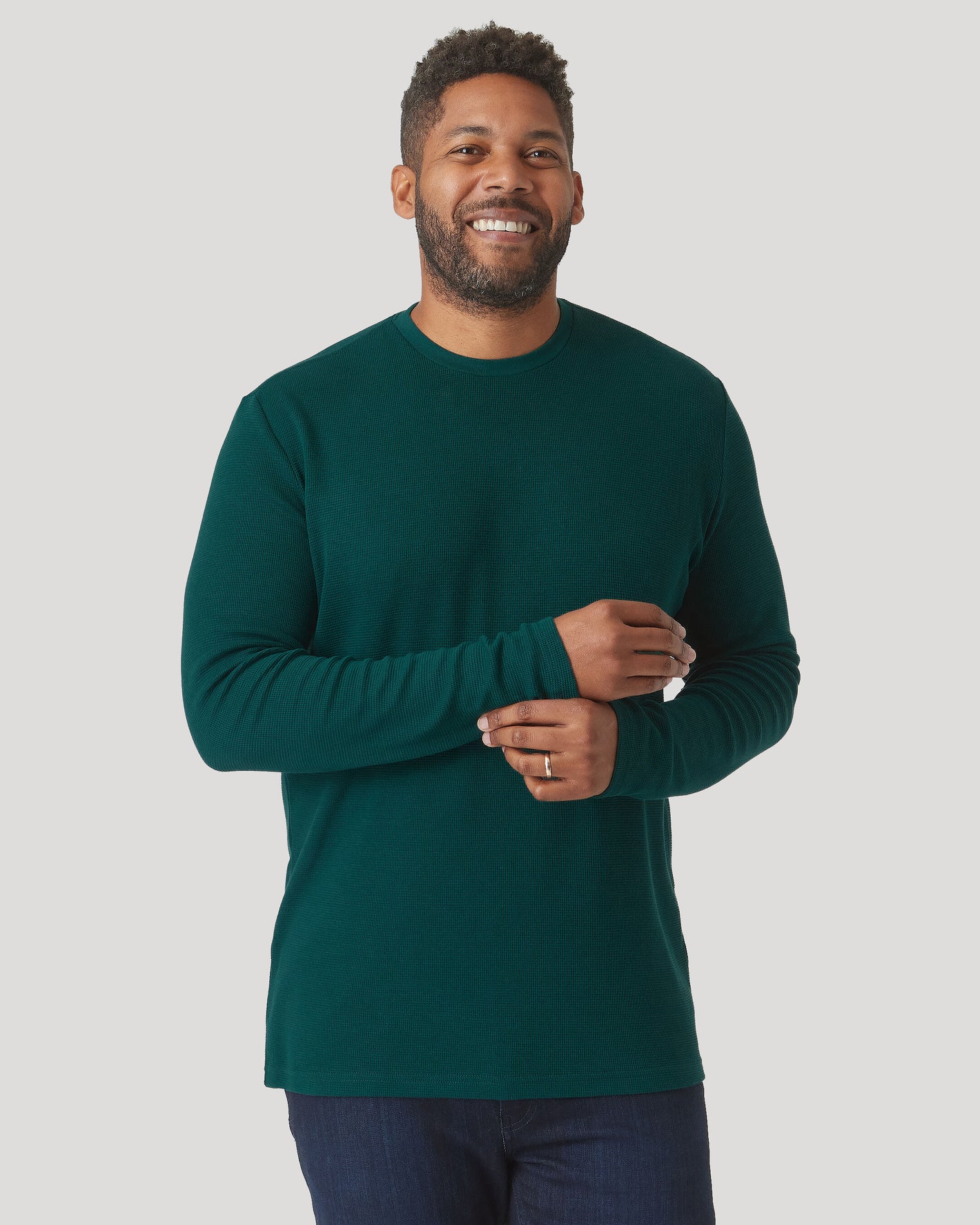 Man wearing Evergreen Heather Waffle Long Sleeve Crew Neck, smiling.