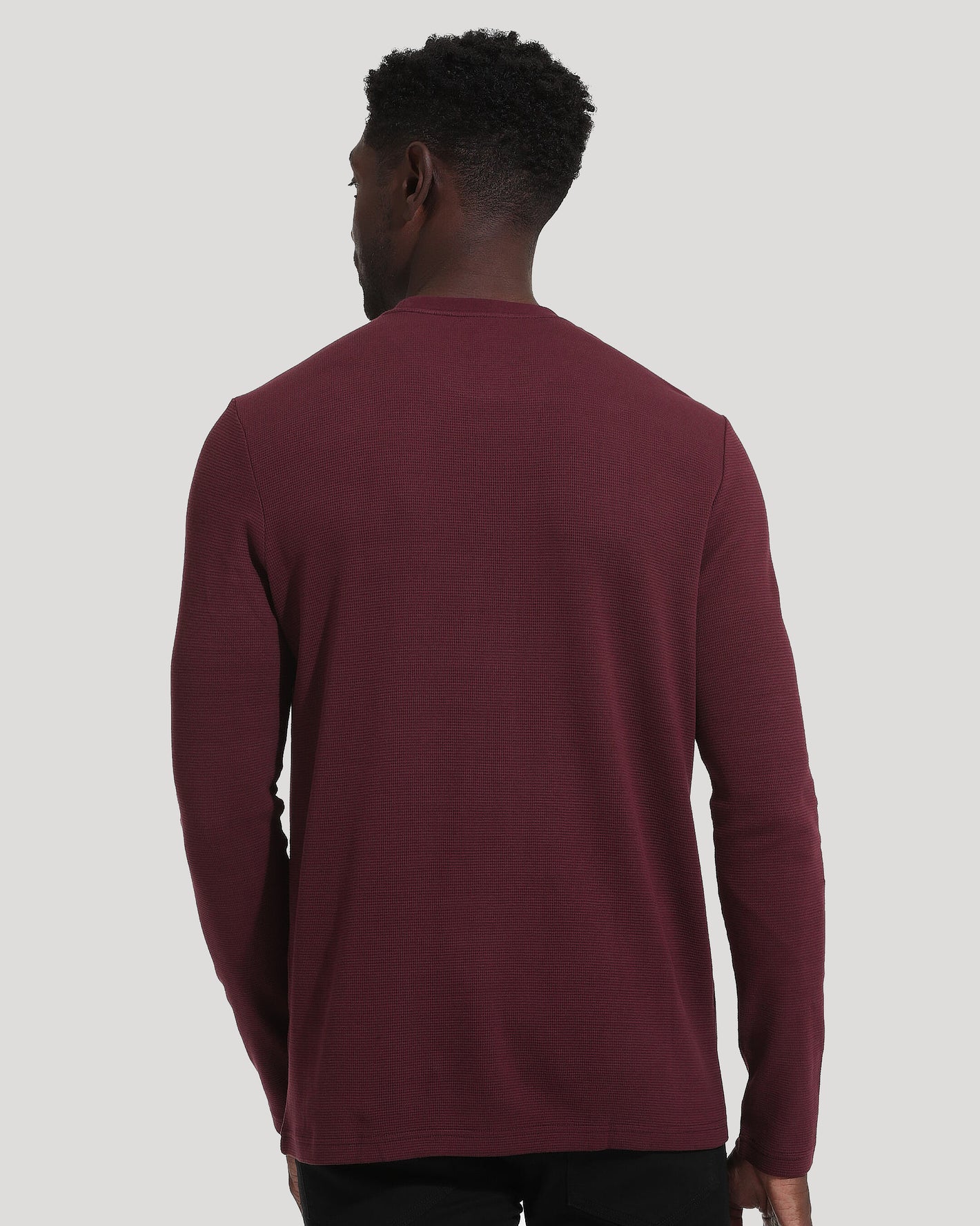 Mahogany Long Sleeve Waffle Crew back view on man, showcasing texture.
