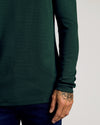 Kale Waffle Long Sleeve Henley with floral hand tattoo visible.