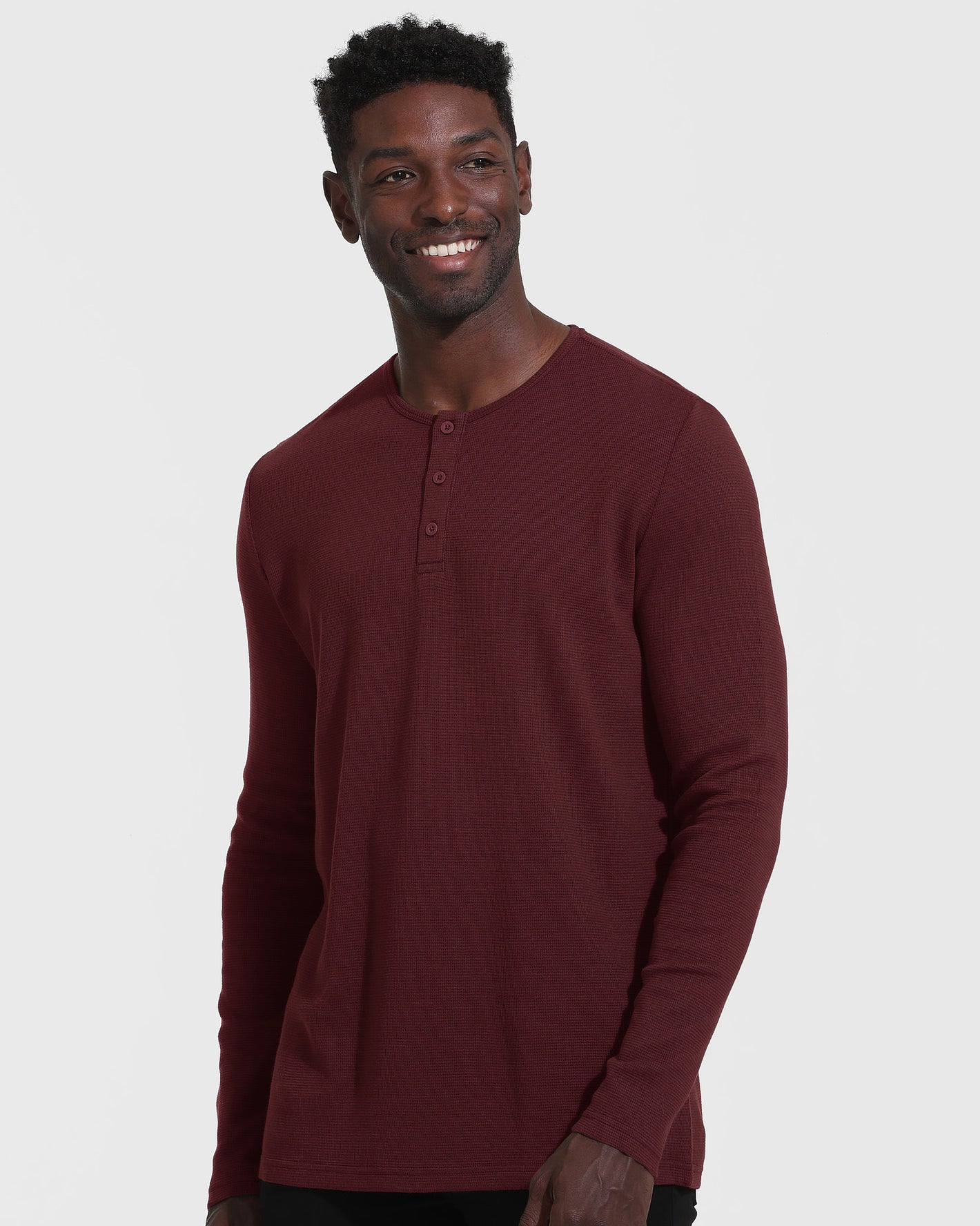Mahogany Long Sleeve Waffle Henley worn by model against light background.