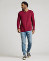 Model wearing Pinot Waffle Long Sleeve Henley with light-wash jeans.
