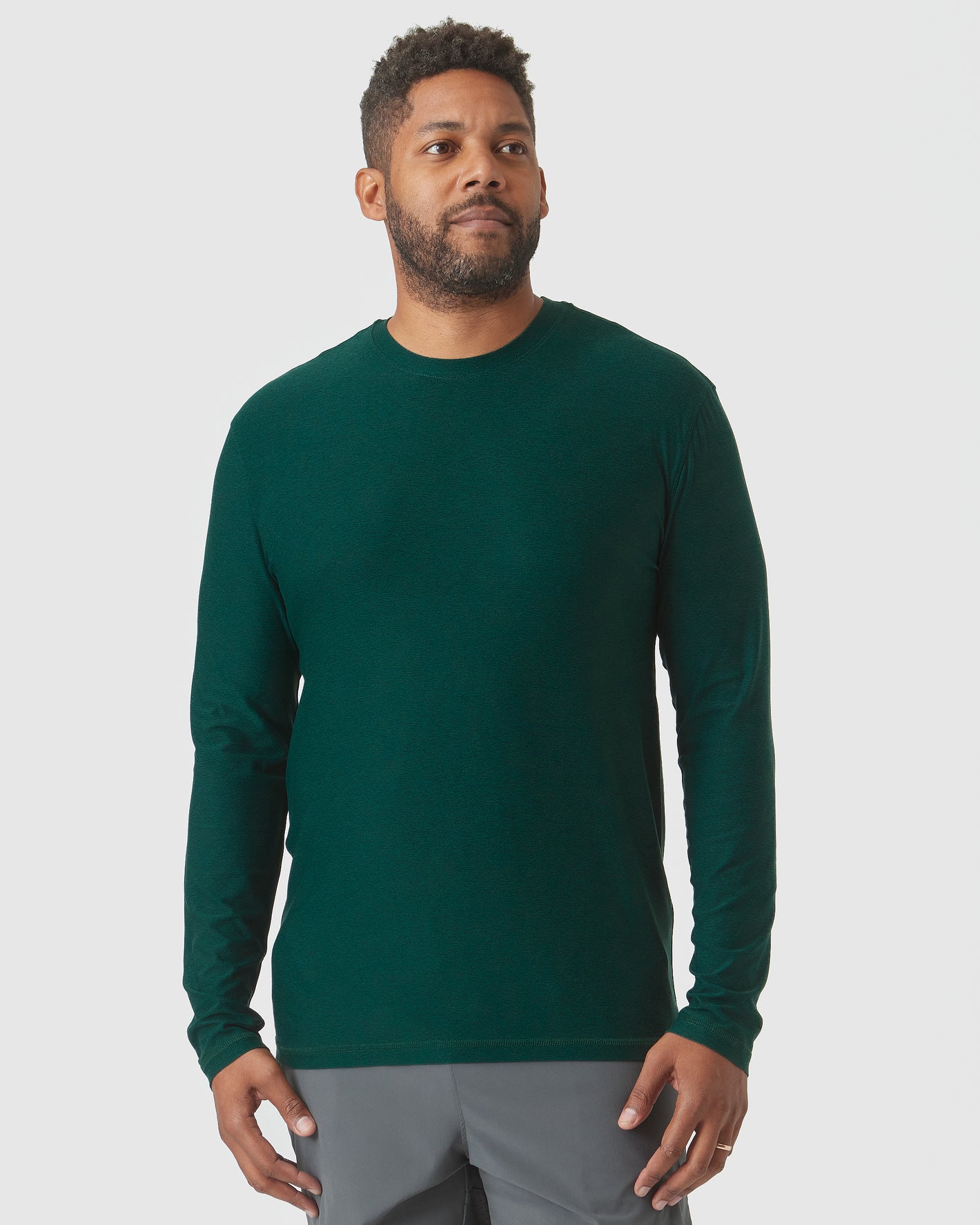 Evergreen Heather Active Long Sleeve Crew T-Shirt, worn by man, side view.