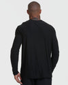 Person wearing Standard Active Long Sleeve Crew T-Shirt in black, back view.