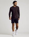 Man wearing Dark Heather Cocoa Active Long Sleeve Crew T-Shirt, black shorts.