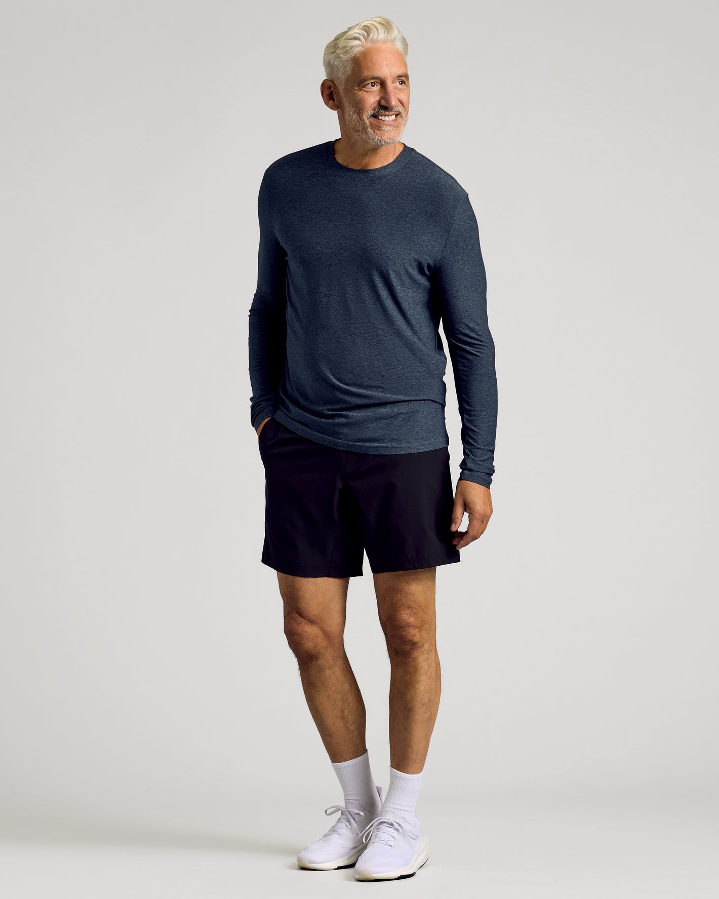 Middle-aged man wears Dark Heather Fiord Active Long Sleeve Crew T-Shirt.
