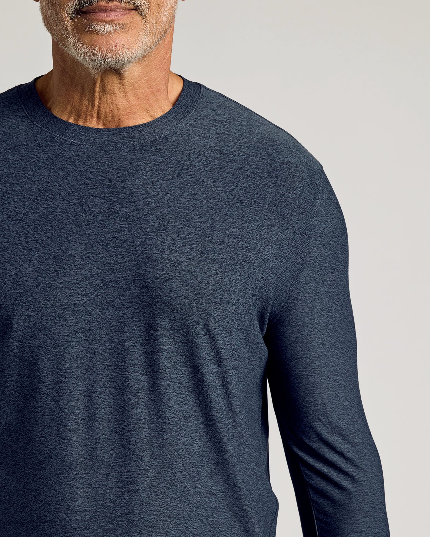 Man wearing Dark Heather Fiord Active Long Sleeve Crew T-Shirt.