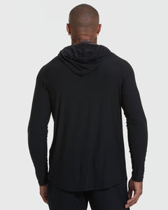 True ClassicBlack Active Hoodie worn by person, hood down, showcasing sleek fit and design.