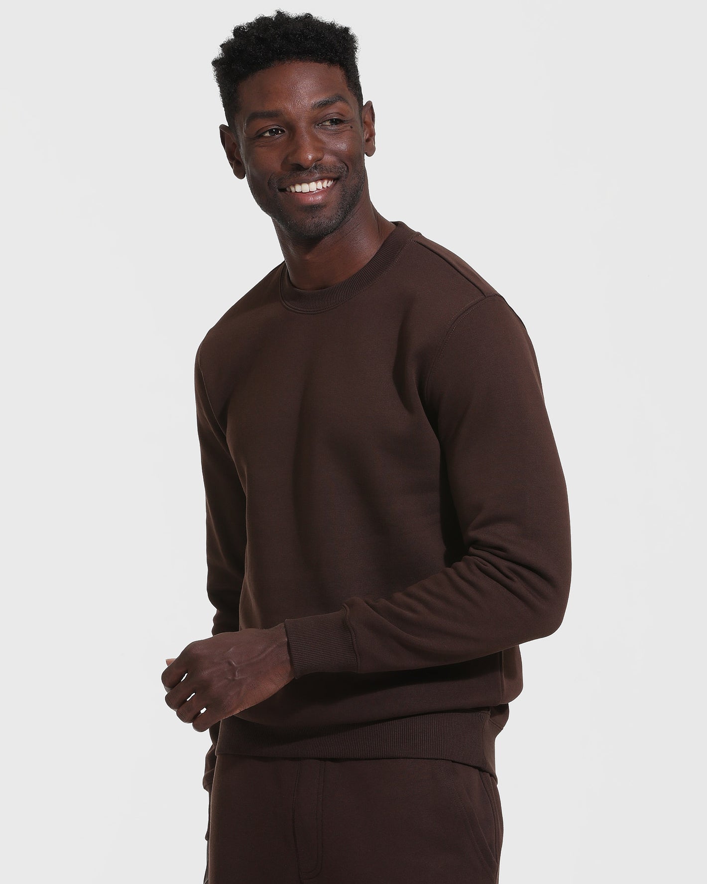 Dark Oak Fleece French Terry Pullover Crew Neck worn by smiling model.