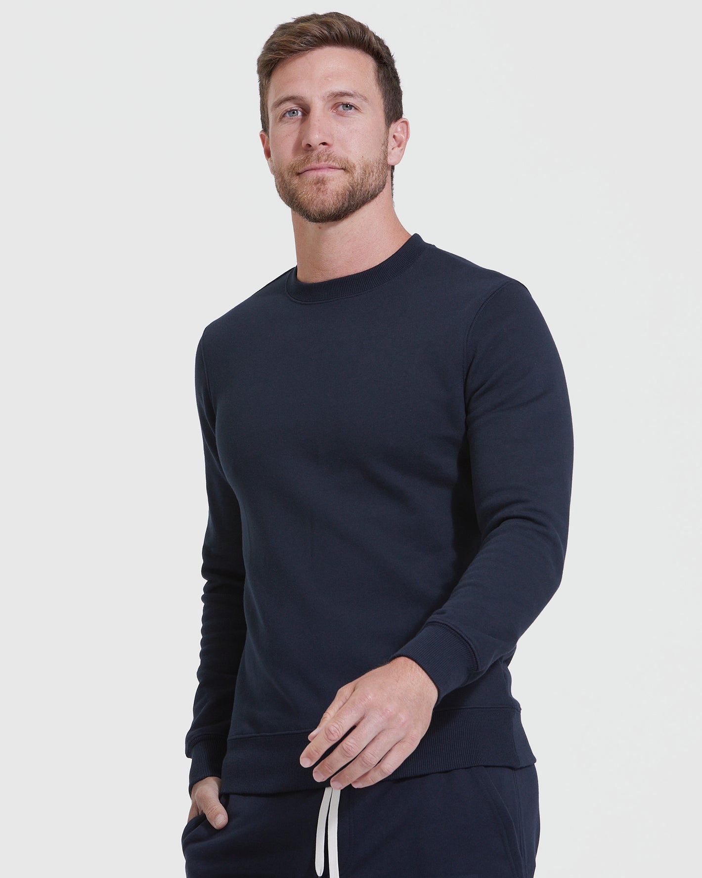 Man models Navy Pullover Fleece Crew & Jogger 2-Pack.