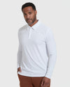 White Long Sleeve Polo on model with rust-brown trousers, hand in pocket.