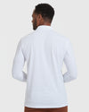 White Long Sleeve Polo worn by man from back view.