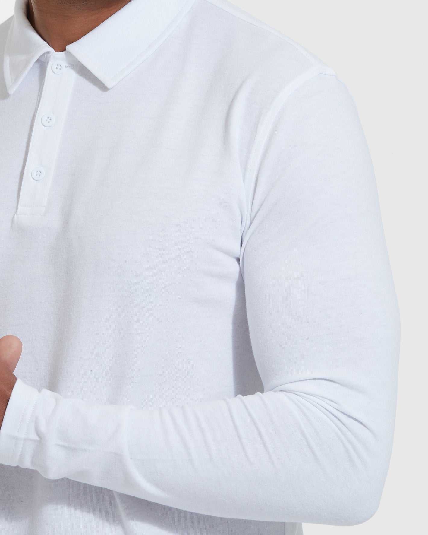White Long Sleeve Polo with collar, button placket, and fitted arms.