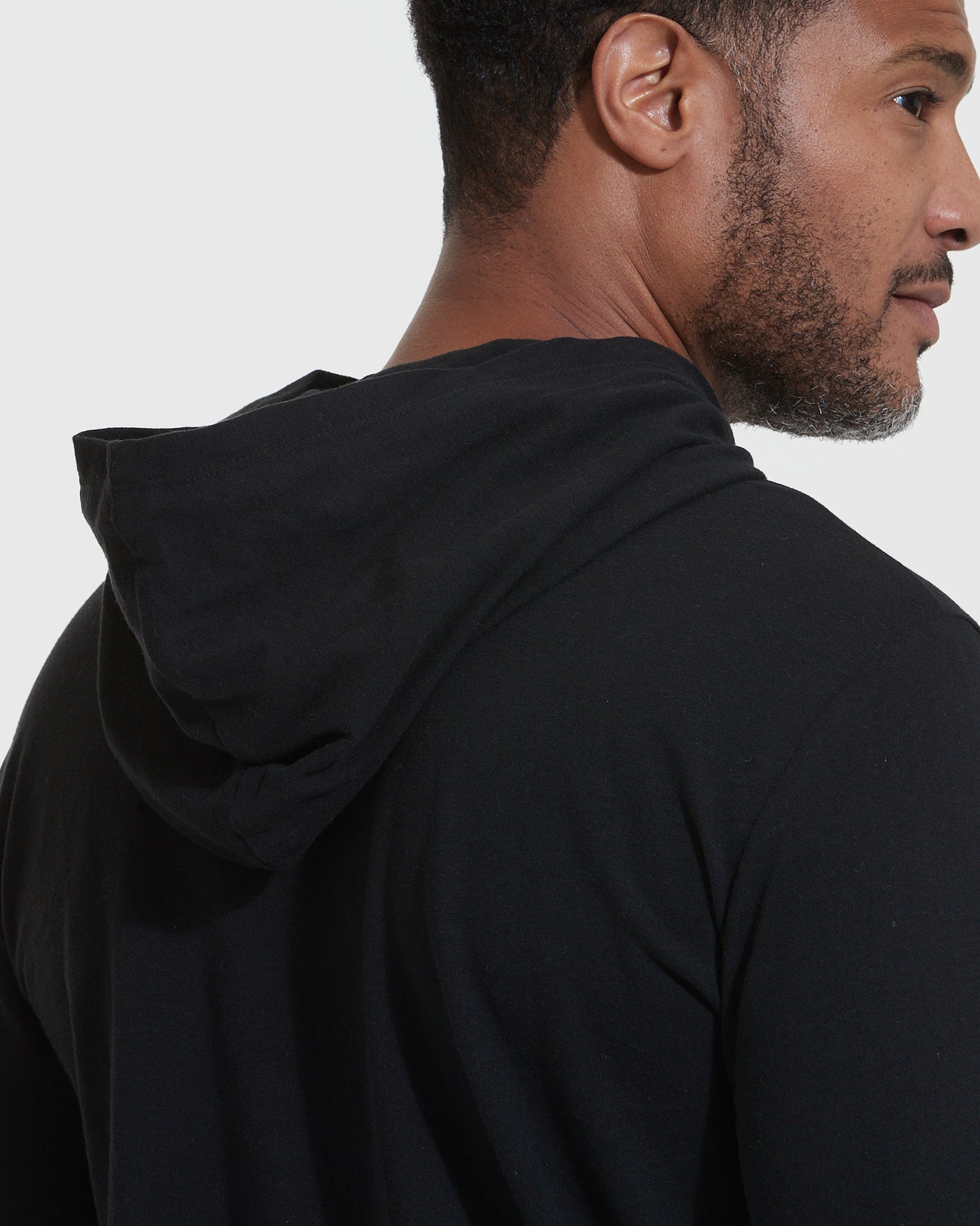 Black Hooded Long Sleeve T-Shirt viewed from the back and side.