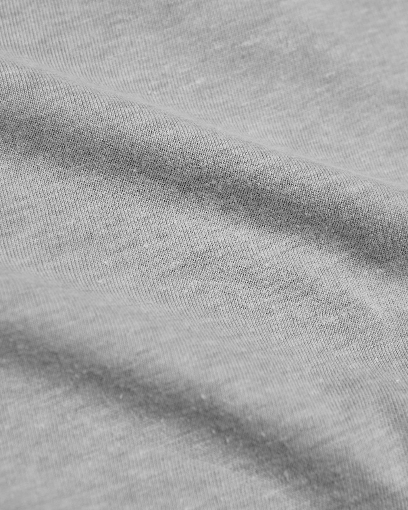 Heather Gray Hooded Long Sleeve T-Shirt macro shot showing soft knit texture.