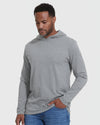 Man in Heather Gray Hooded Long Sleeve T Shirt and jeans.