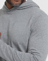 Heather Gray Hooded Long Sleeve T-Shirt worn by a model, arms crossed.