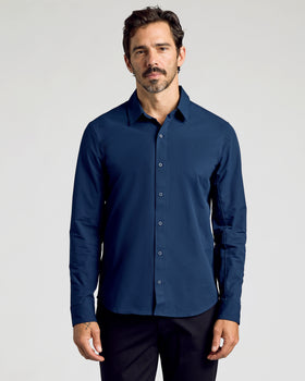 Navy Commuter Long Sleeve Shirt worn by man, arms relaxed.