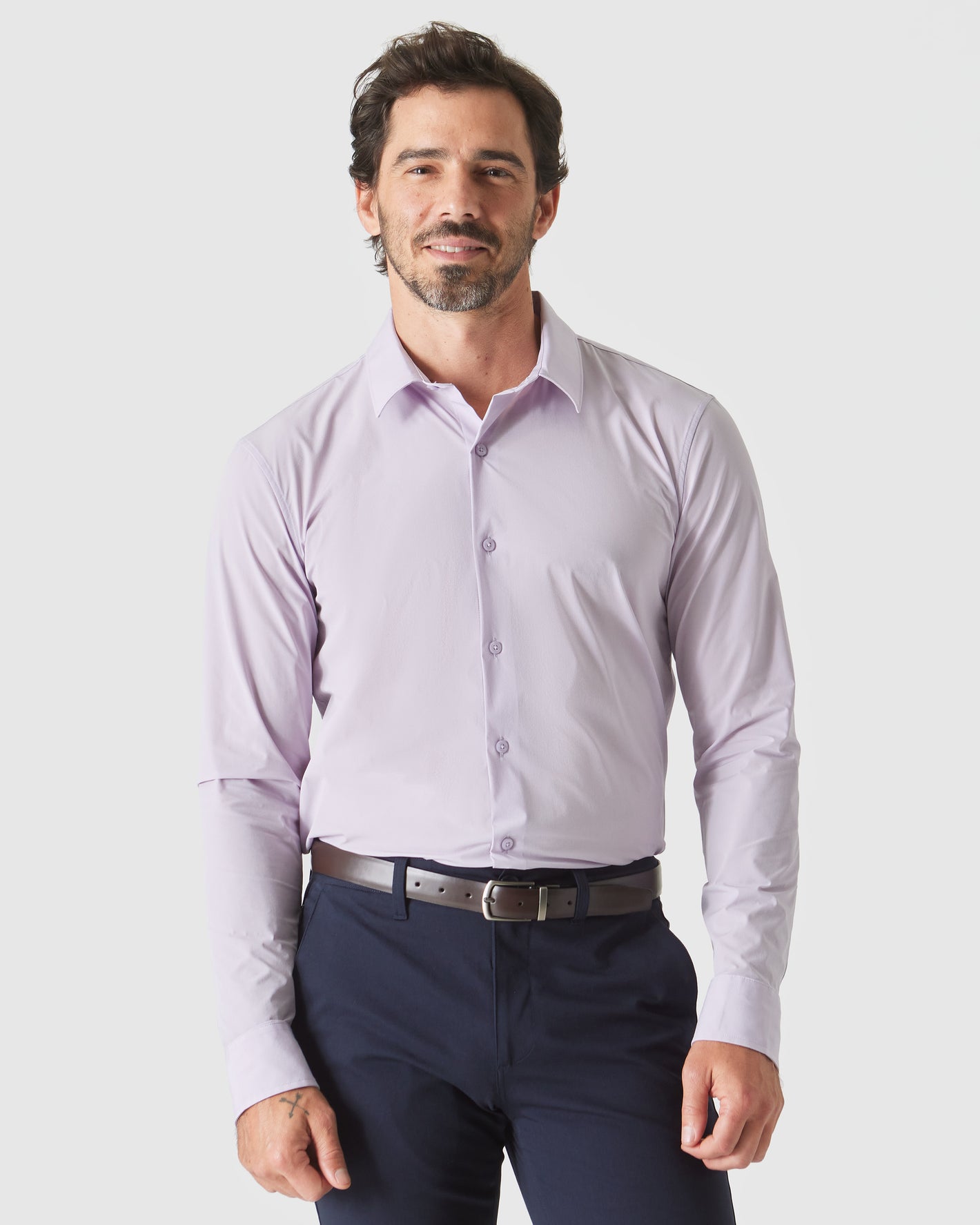 Man wearing Orchid Long Sleeve Lightweight Dress Shirt with navy trousers and belt.