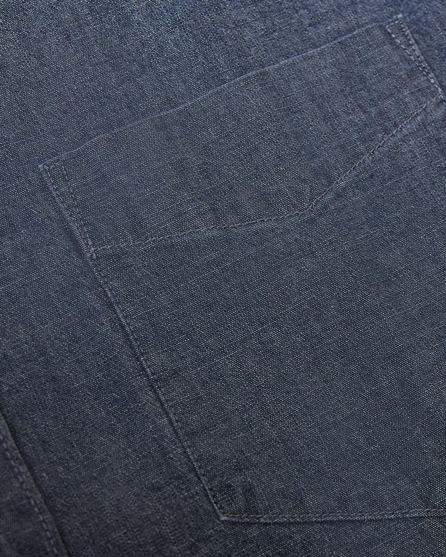 Medium Indigo Wash Long Sleeve Chambray Shirt pocket detail.