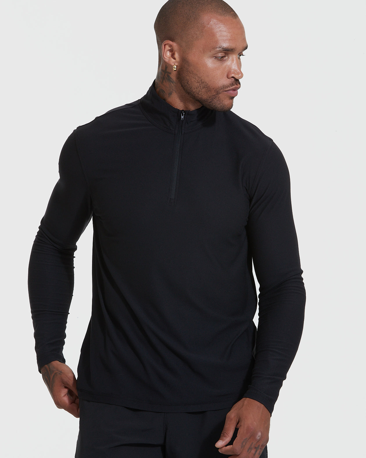 Model in Black Active Quarter Zip Shirt, athletic fit, slim design.