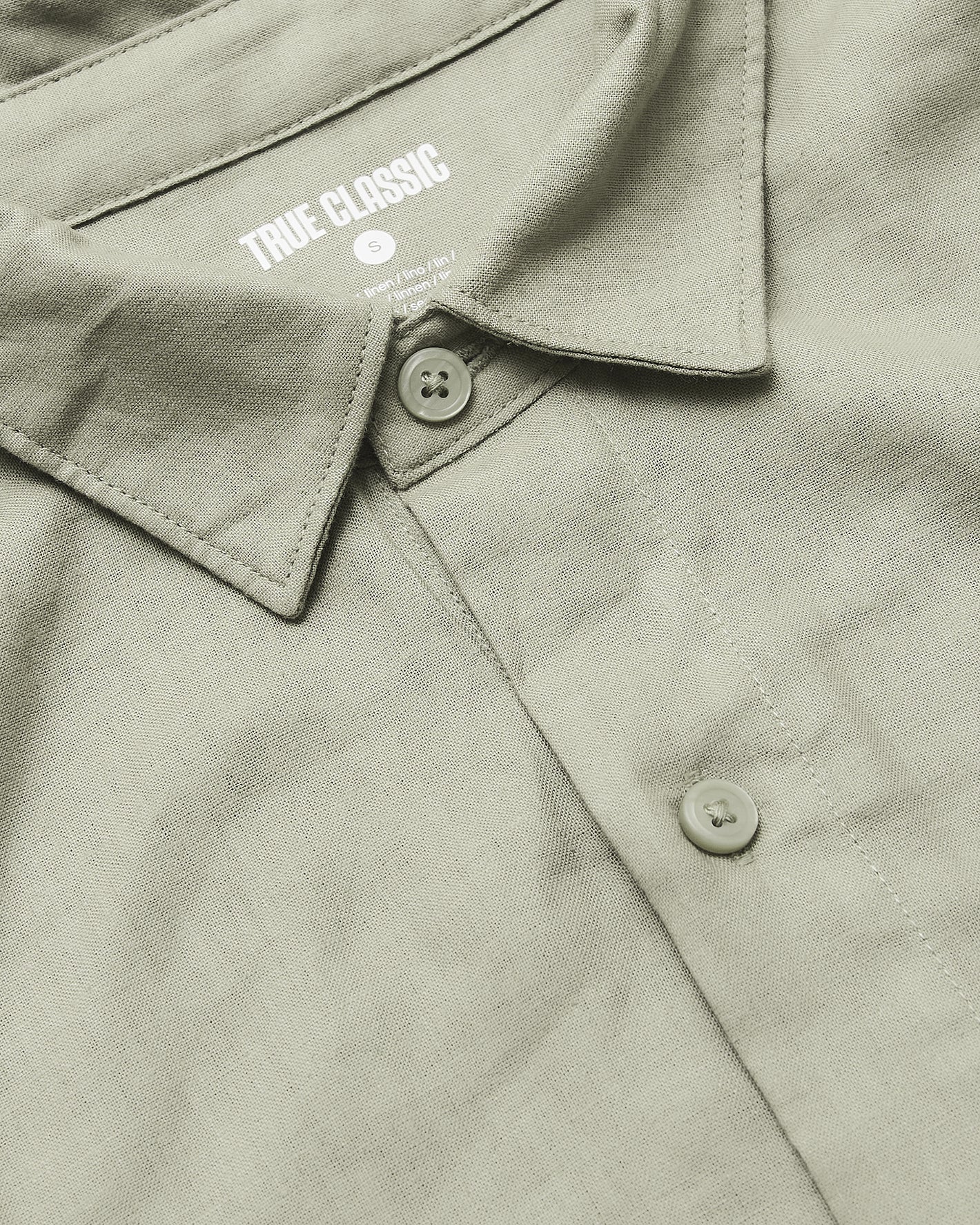 Mossy Oak Long Sleeve Linen Shirt with collar and buttons visible.