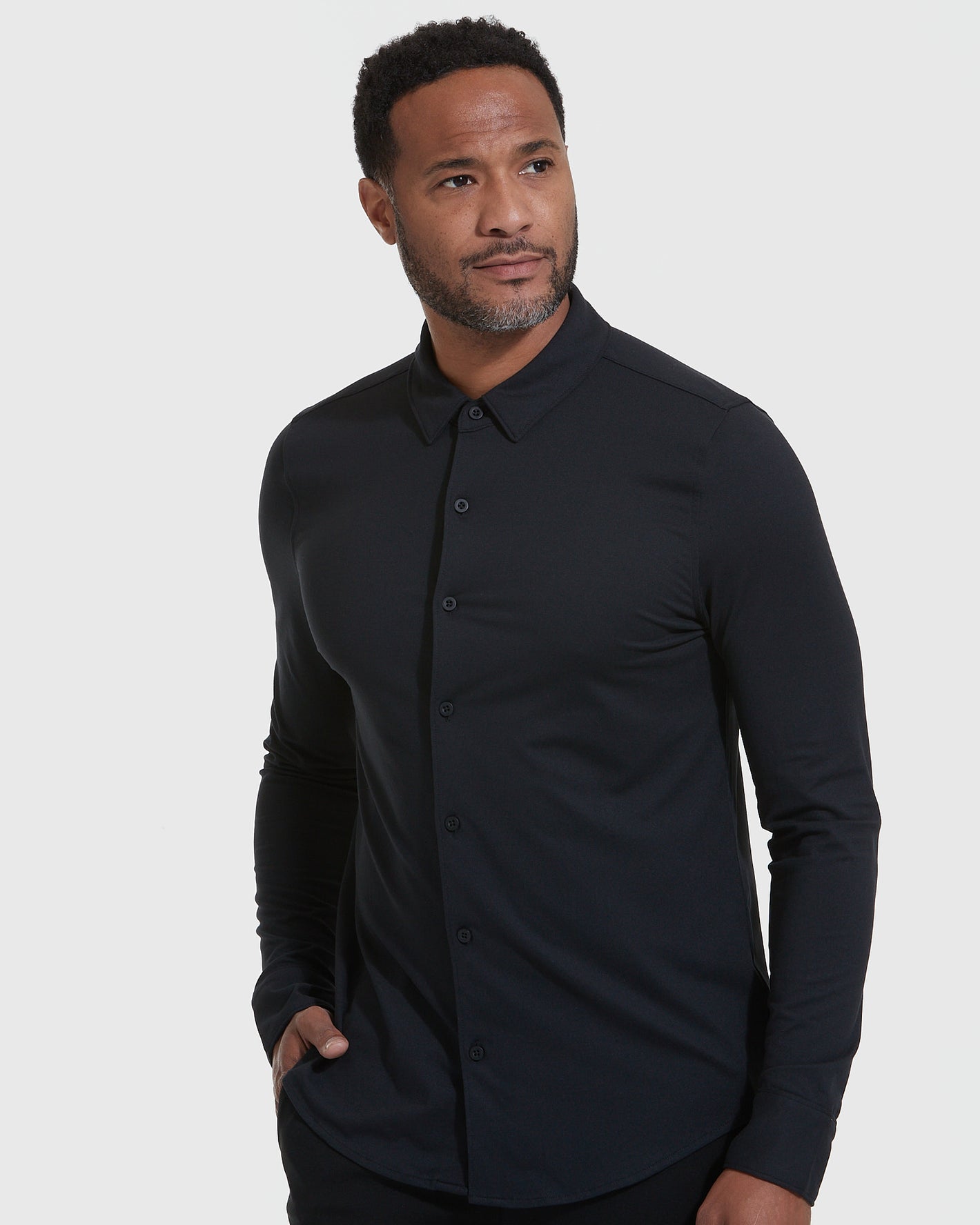 Model wearing Long Sleeve Do-It-All Comfort Shirt, showcasing its sleek, relaxed fit.
