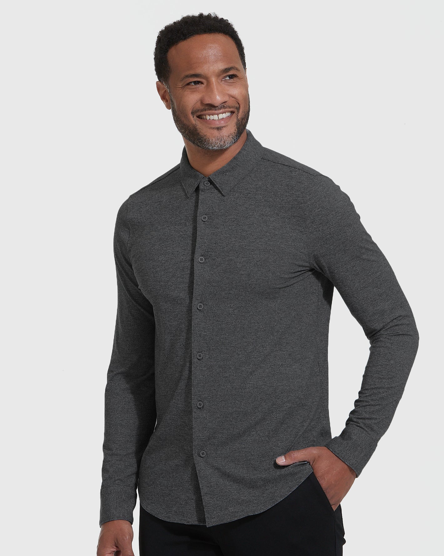 Model wearing Long Sleeve Do-It-All Comfort Shirt, dark charcoal-grey.