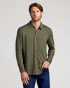 Model wears Dark Heather Military Green Long Sleeve Do-It-All Comfort Shirt.