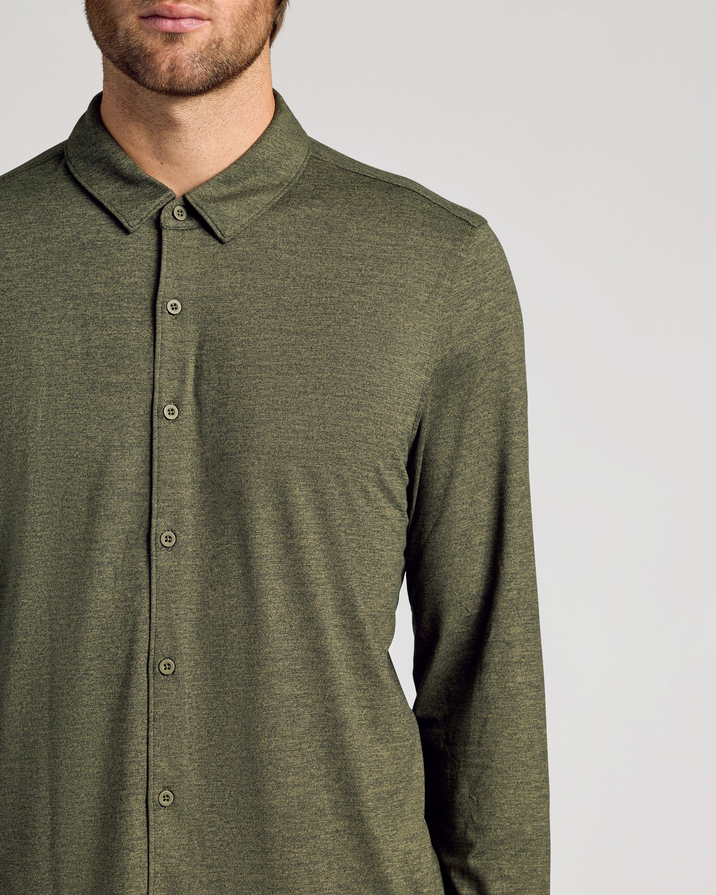 Man wearing Dark Heather Military Green Long Sleeve Do-It-All Comfort Shirt.