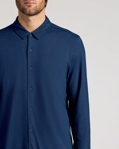 True ClassicMan wearing a blue button-up shirt against a light gray background