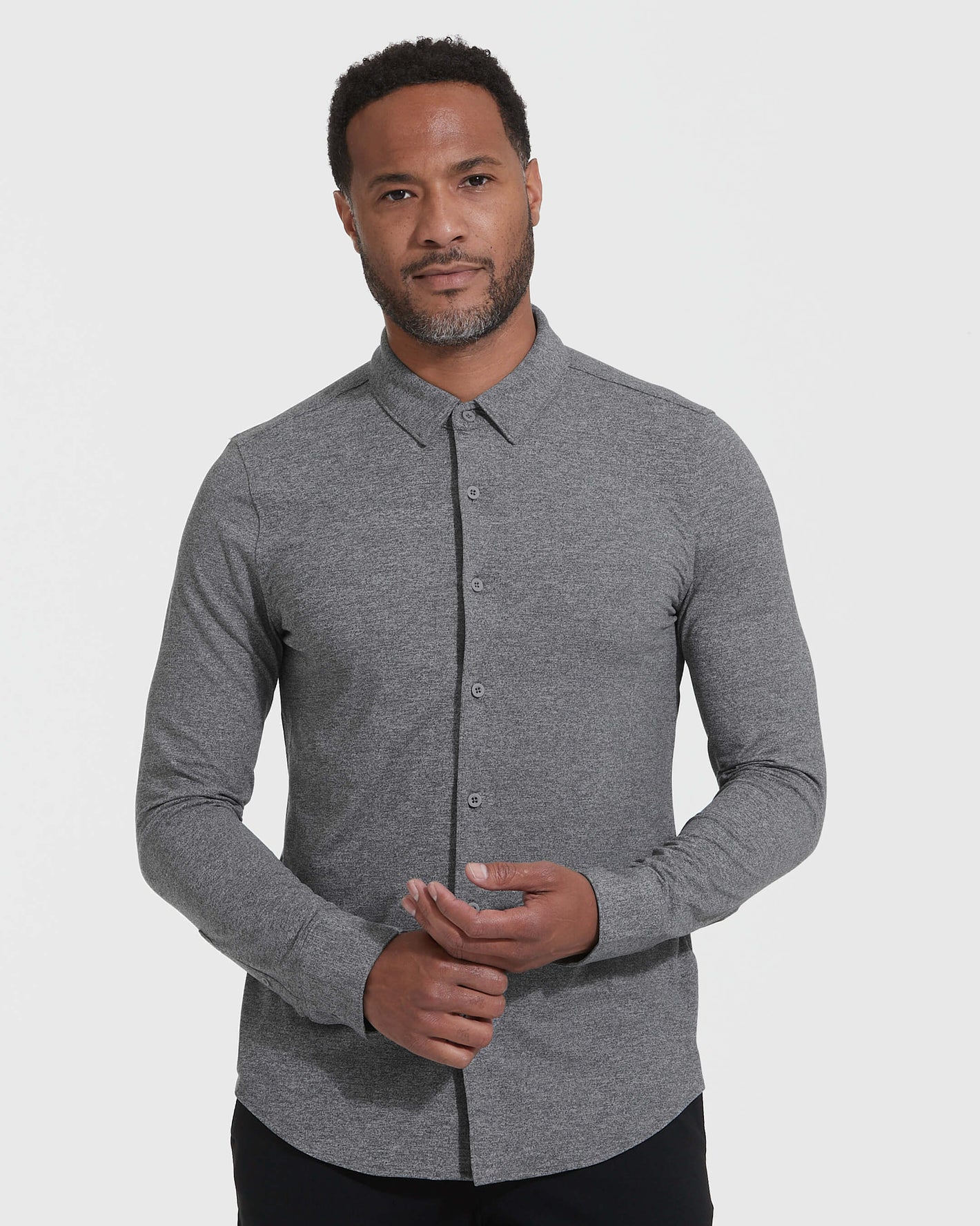 Man wearing Heather Gray Long Sleeve Do-It-All Comfort Shirt.