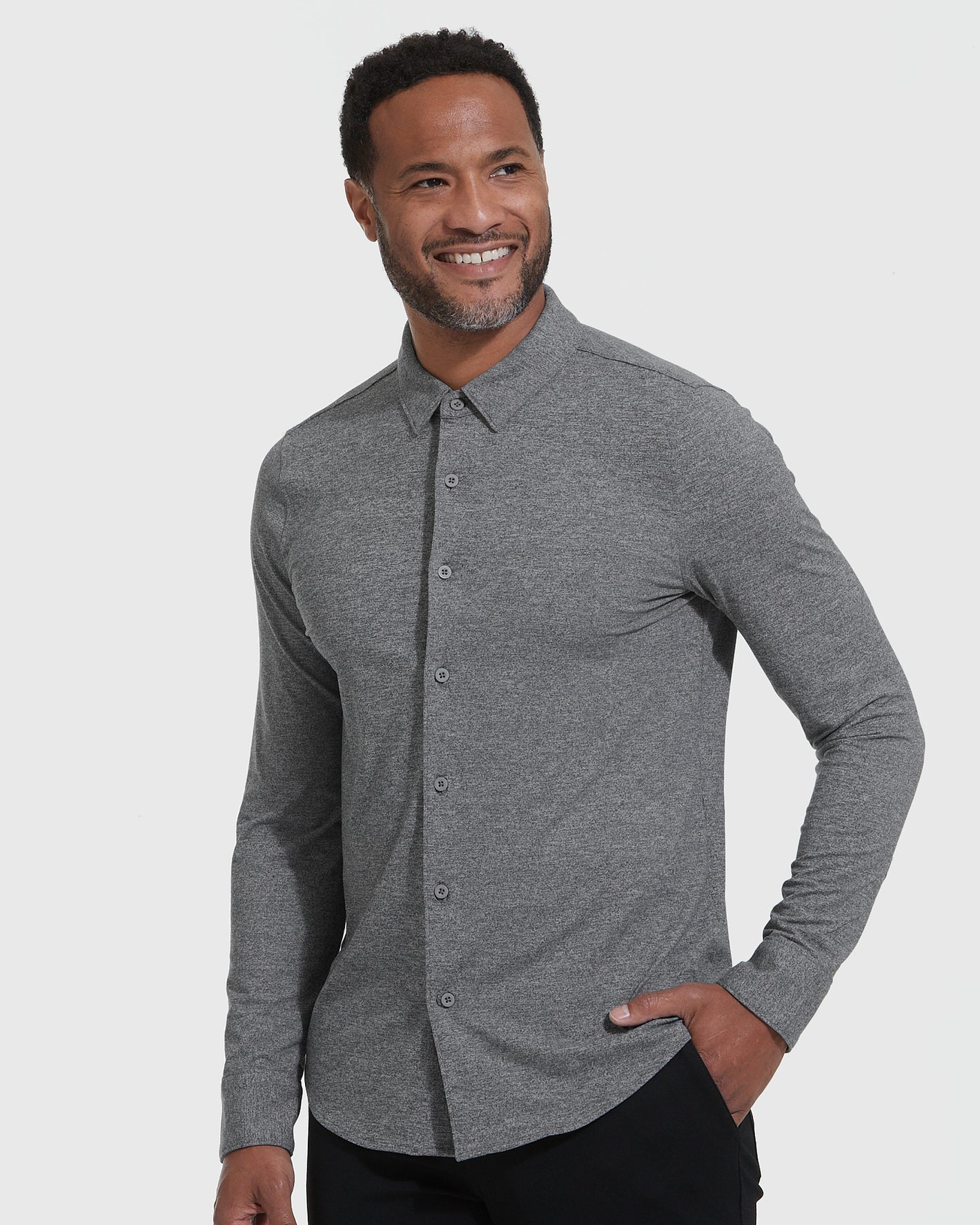 Man wearing the Long Sleeve Do-It-All Comfort Shirt 3-Pack, smiling confidently.