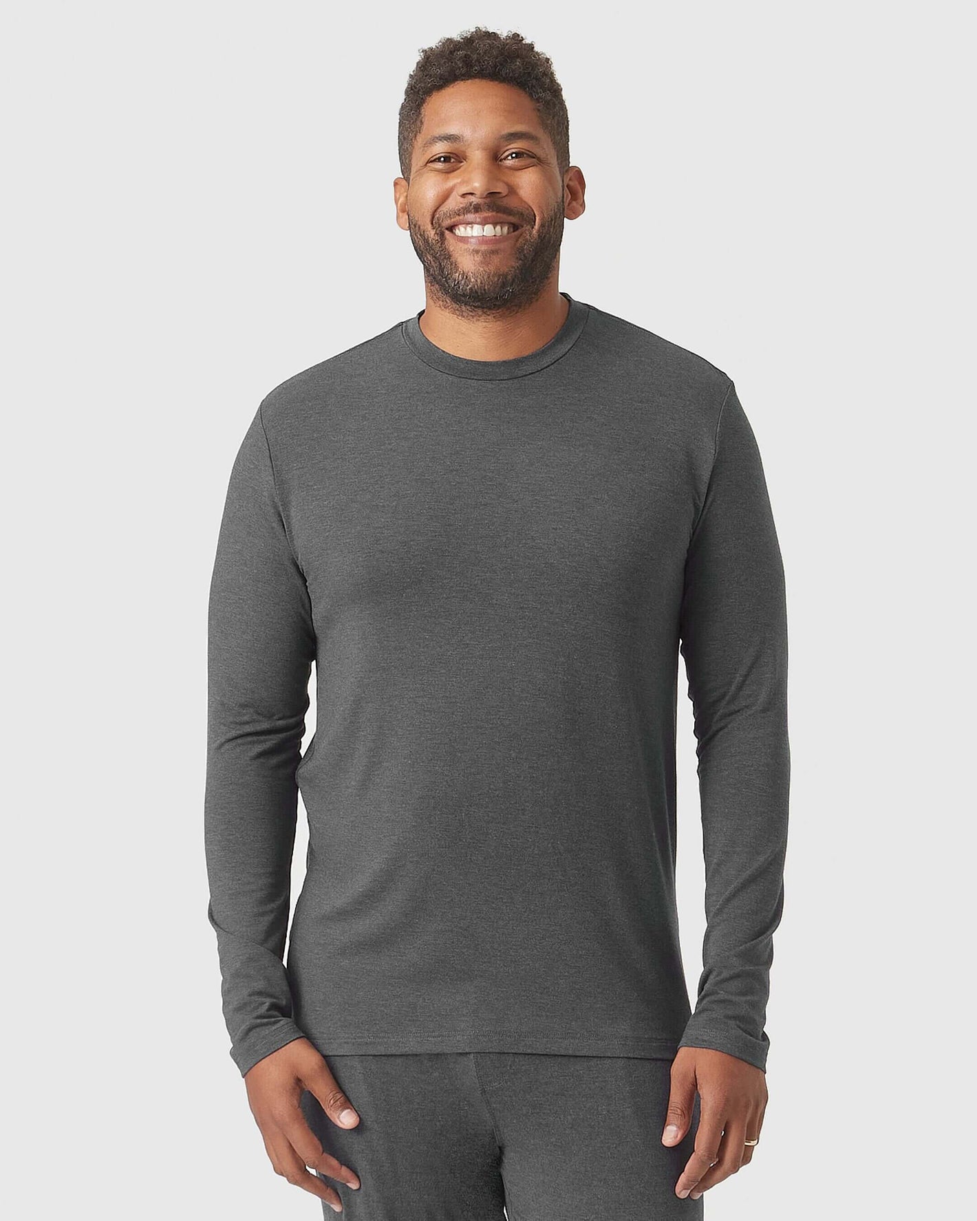 Man modeling Charcoal Heather Gray Loungewear Long Sleeve Tee and Jogger Set.