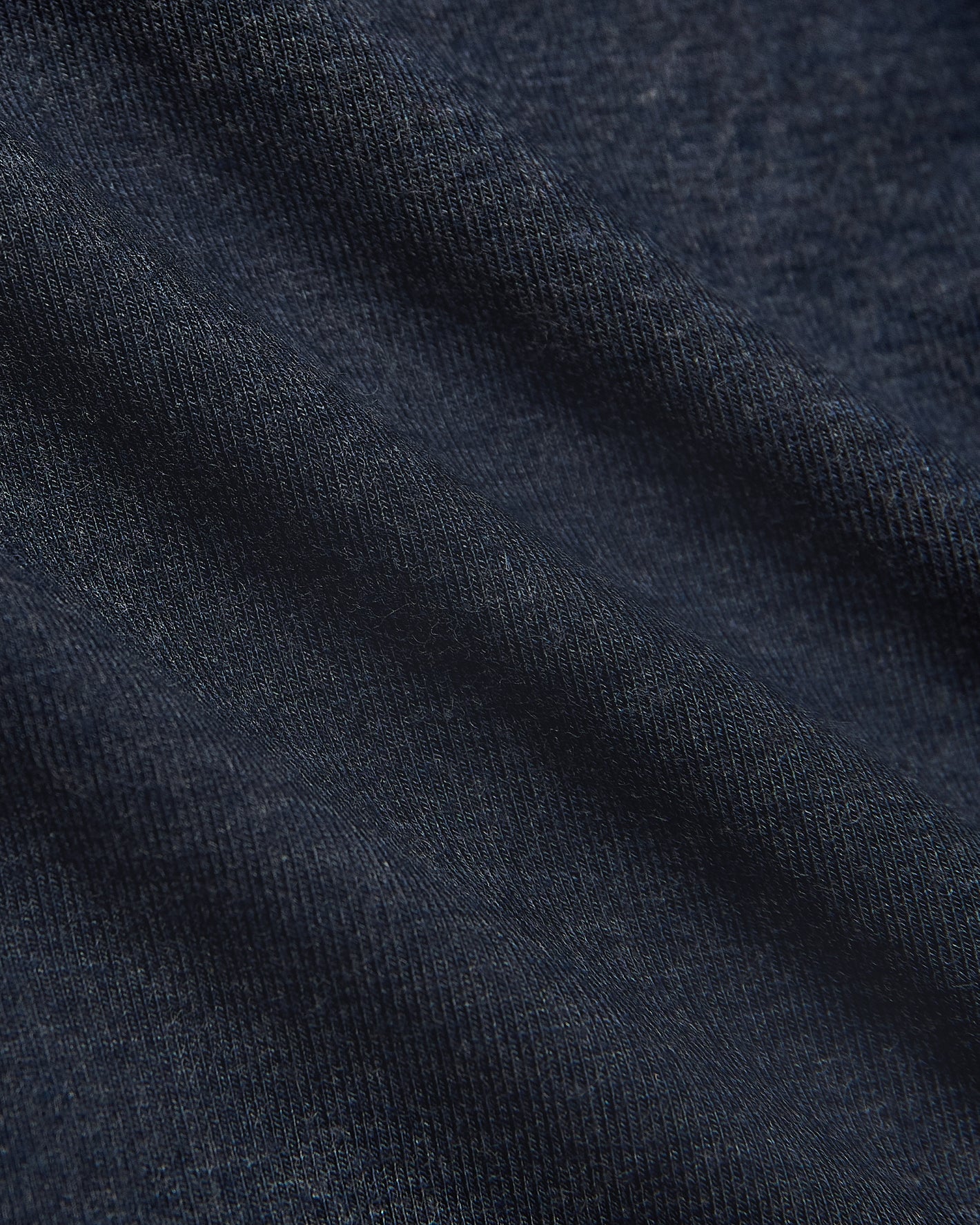 Heather Navy Long Sleeve Loungewear Tee close-up showing knit texture and folds.
