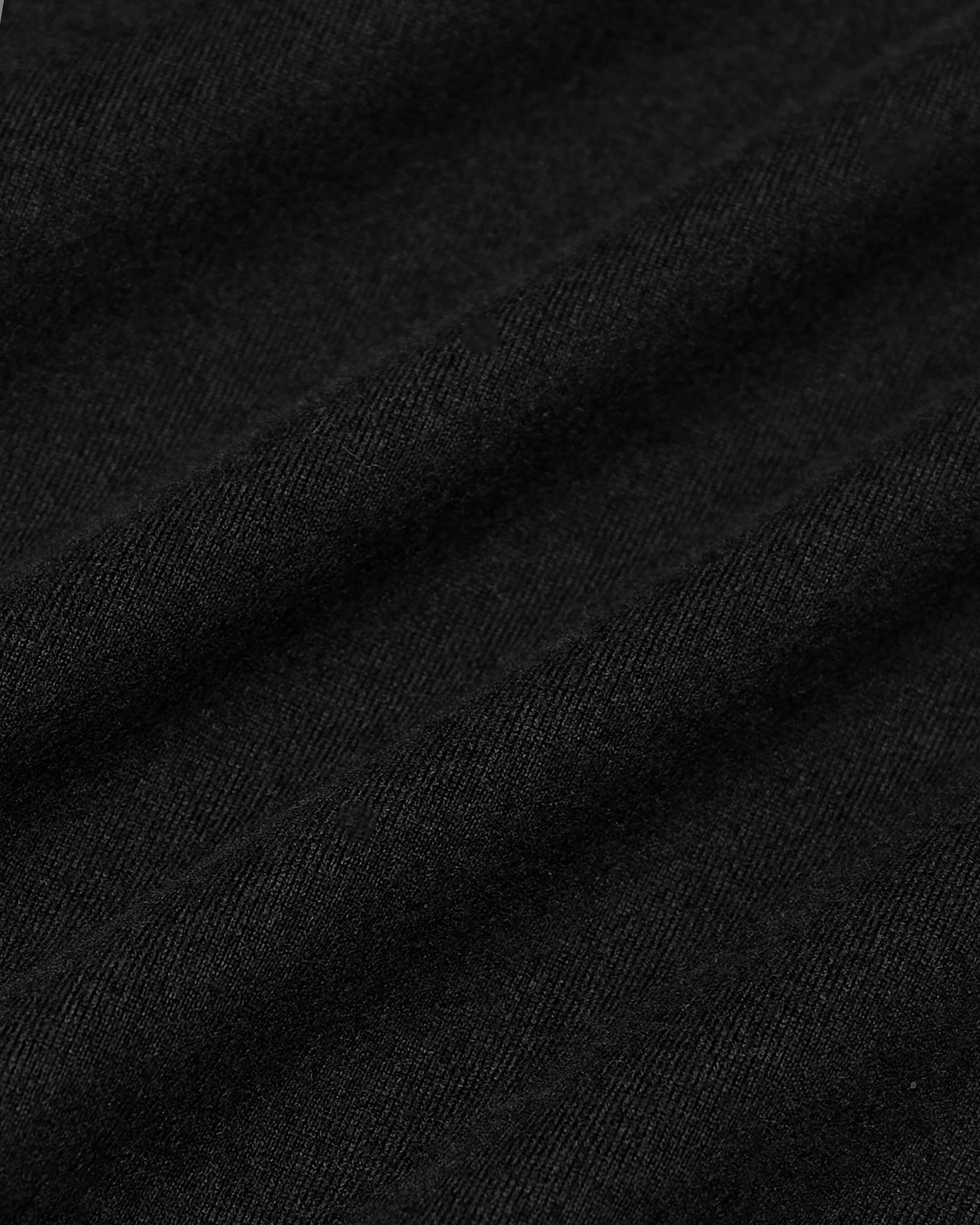 Black Active Comfort Full Zip Hoodie fabric close-up, showcasing fine texture.