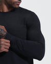 Man wearing Black Active Comfort Crew Sweatshirt, showcasing its slim fit and stretch.