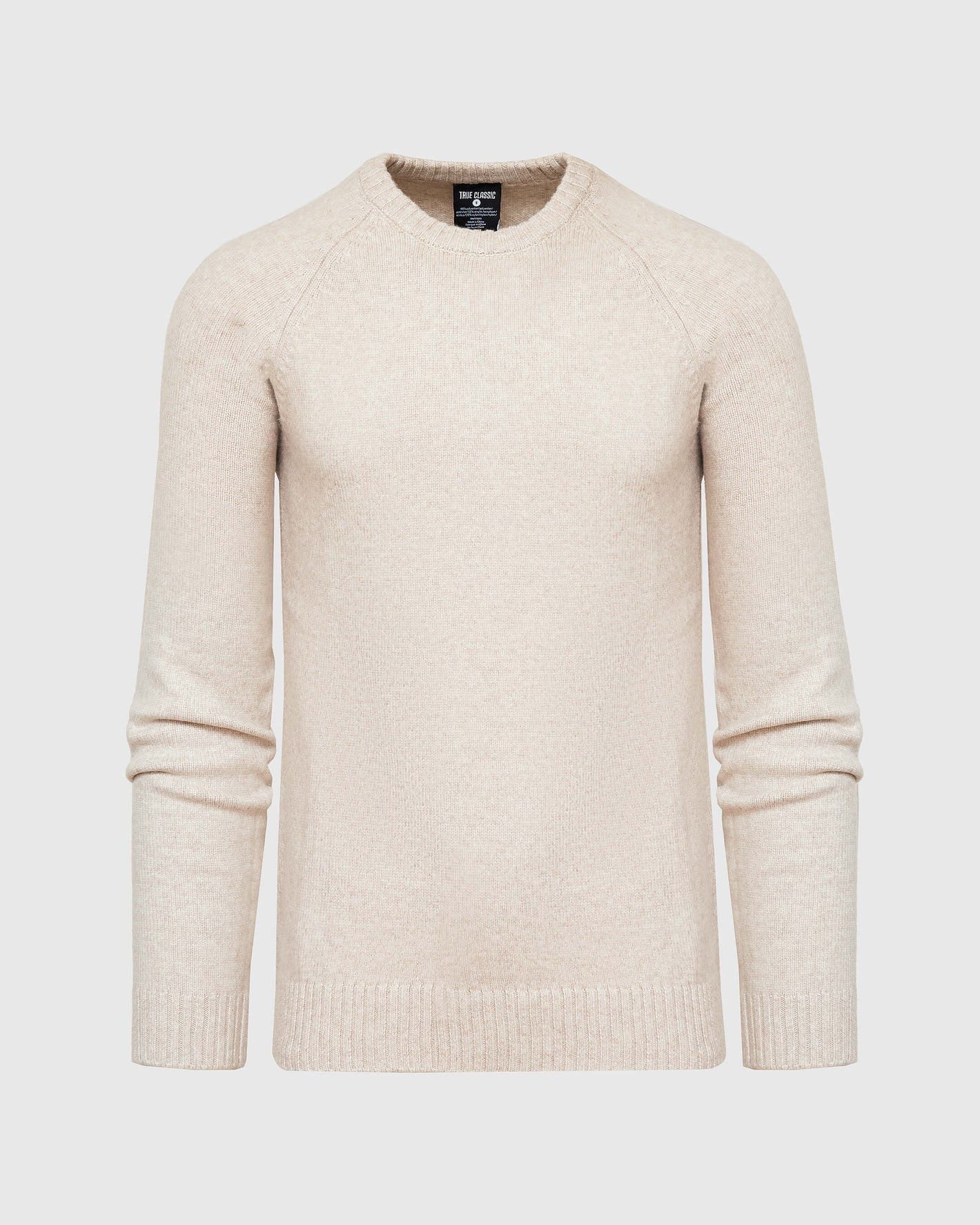 Heather Oatmeal Crew Neck Sweater laid flat with ribbed cuffs visible.