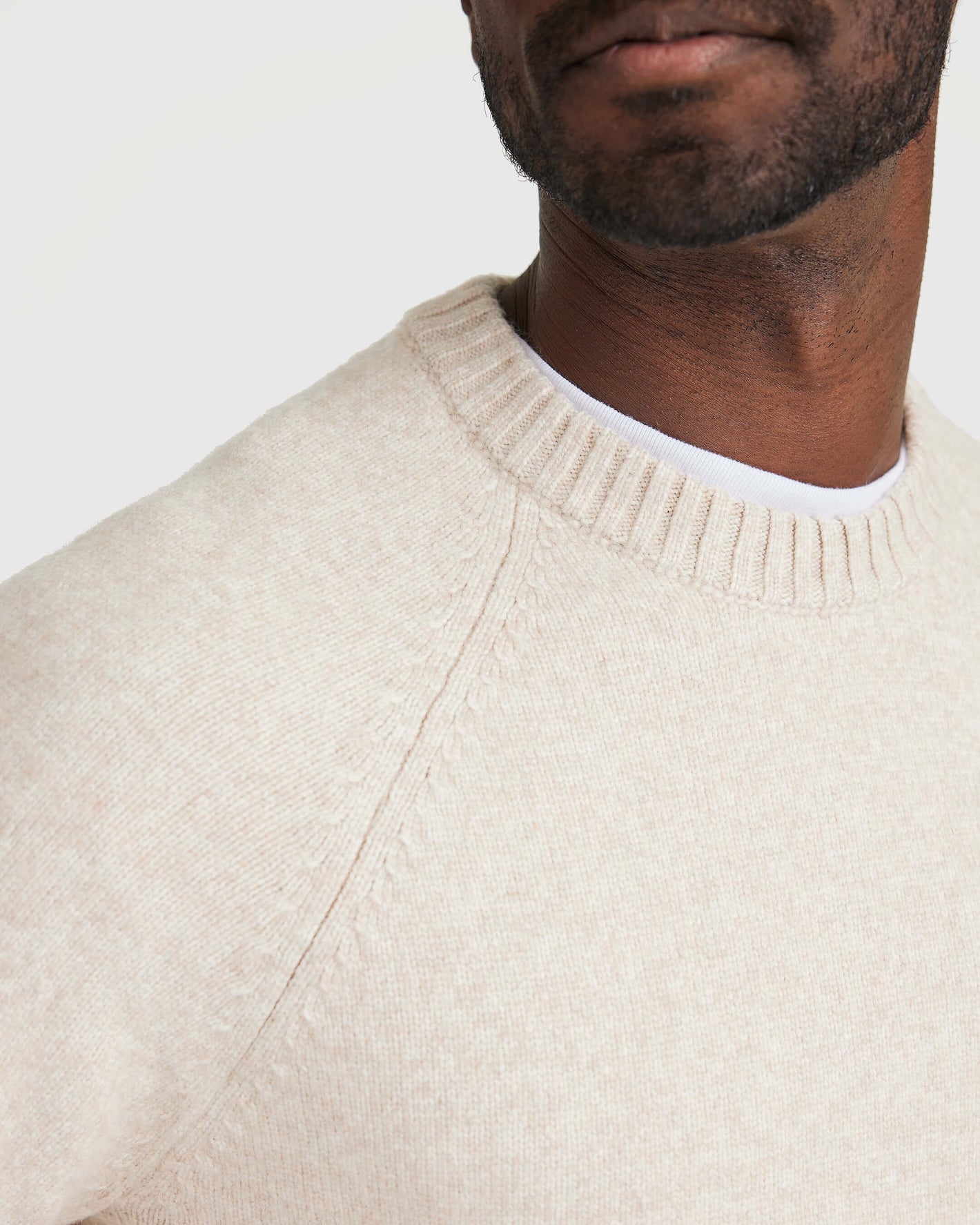 Heather Oatmeal Crew Neck Sweater, close-up of ribbed details and fit.