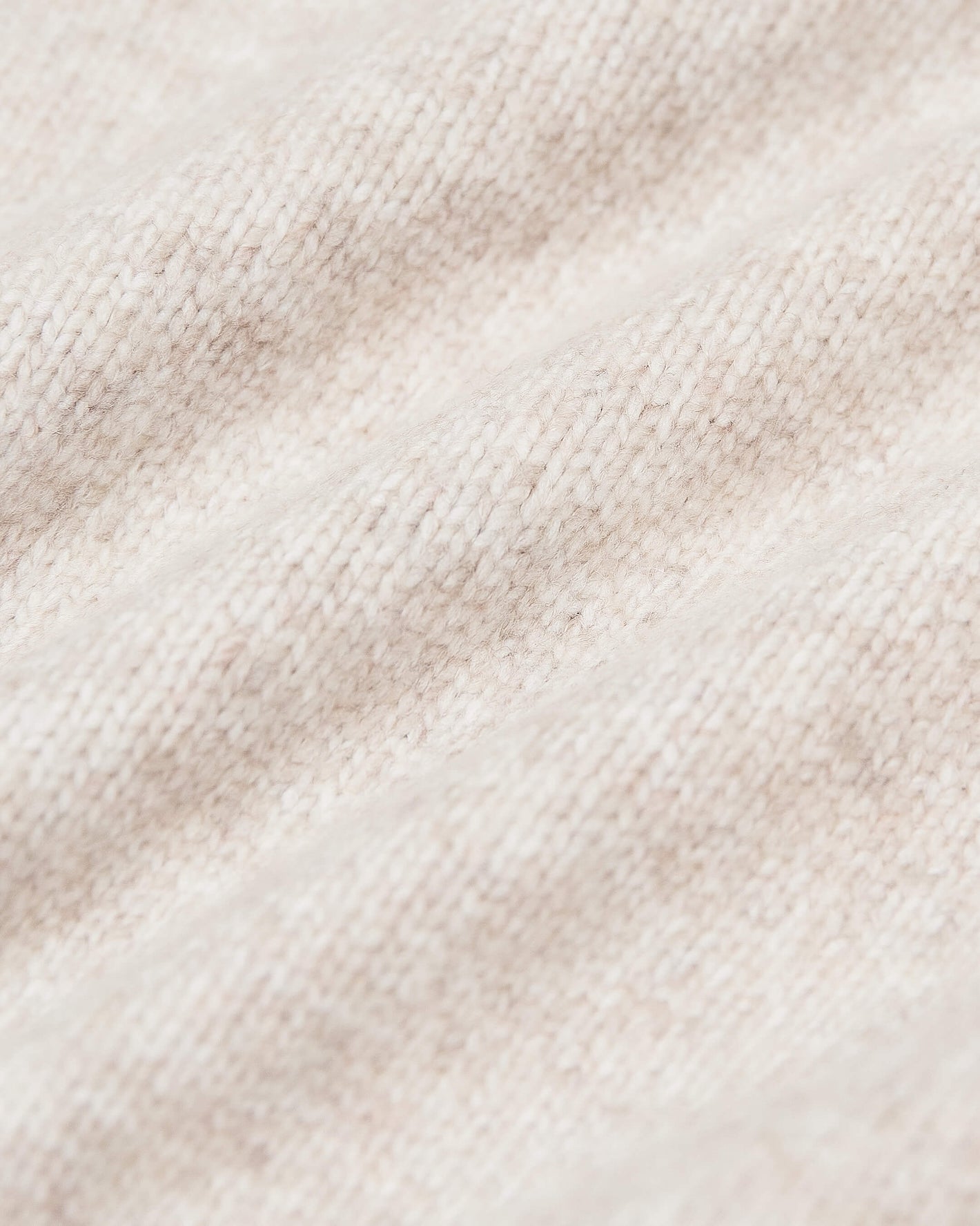 Heather Oatmeal Crew Neck Sweater showcasing soft, knitted texture.